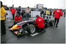 Sebastian Vettel with his mechanics